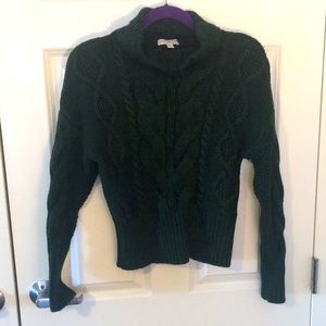Mock neck Eva Mendes cable knit sweater.
